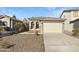 One-story home with a two-car garage and desert landscaping at 44792 W Miraflores St, Maricopa, AZ 85139
