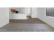 Open concept living and dining area with tile and carpet at 44792 W Miraflores St, Maricopa, AZ 85139