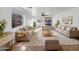 Bright living room with ample seating and large windows at 44792 W Miraflores St, Maricopa, AZ 85139