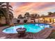 Inviting swimming pool with brick decking and sunset views at 4721 E Wilshire Dr, Phoenix, AZ 85008