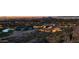 Stunning aerial view of city lights, golf course, and resort amenities at 5000 E Camelback Ridge Rd # 406, Scottsdale, AZ 85251