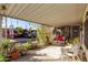 Inviting front porch with seating, lush plants, and decorative accents at 5502 E Baywood Ave, Mesa, AZ 85206