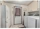 Laundry room equipped with a full-size washer and dryer, and additional storage at 5502 E Baywood Ave, Mesa, AZ 85206