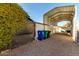 Covered RV carport with gravel parking area at 5502 E Baywood Ave, Mesa, AZ 85206