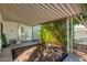 Side yard with AC unit, gate, and greenery at 5502 E Baywood Ave, Mesa, AZ 85206