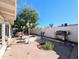 Large backyard with brick patio, fountain, and grill at 6803 W Cherry Hills Dr, Peoria, AZ 85345