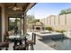 Backyard oasis with a pool, hot tub, fireplace, and covered patio area at 8146 E Wingspan Way, Scottsdale, AZ 85255