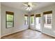 Bright bedroom with wood floors and large windows at 8146 E Wingspan Way, Scottsdale, AZ 85255