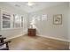 Bedroom with light wood floors, plantation shutters, and an ornate cabinet at 8146 E Wingspan Way, Scottsdale, AZ 85255