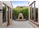 Charming courtyard with a fireplace and pavers at 8146 E Wingspan Way, Scottsdale, AZ 85255
