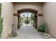 Private courtyard with gated entry, desert landscaping, and paver walkway at 8146 E Wingspan Way, Scottsdale, AZ 85255