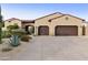 Beautiful home with desert landscaping, a tile roof, and a two-car garage at 8146 E Wingspan Way, Scottsdale, AZ 85255