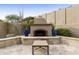 Outdoor fireplace with a seating area perfect for entertaining at 8146 E Wingspan Way, Scottsdale, AZ 85255