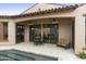 Covered patio with seating area overlooking the pool at 8146 E Wingspan Way, Scottsdale, AZ 85255