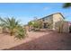 Spacious backyard featuring a covered patio, storage shed, and lush greenery at 8214 S 15Th St, Phoenix, AZ 85042