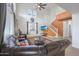 Living room with high ceilings, wood-look tile floors, and view of the kitchen and staircase at 8214 S 15Th St, Phoenix, AZ 85042