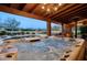 Hot tub with a view of the pool and backyard at 8304 E Gail Rd, Scottsdale, AZ 85260