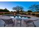 Relaxing pool area with fire pit and lounge chairs at 8304 E Gail Rd, Scottsdale, AZ 85260