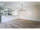 Bright dining area with hardwood floors and modern chandelier at 8407 N 33Rd Ave, Phoenix, AZ 85051