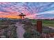 Gazebo at the community garden with a colorful sunset and homes at 9859 E Tungsten Dr, Mesa, AZ 85212