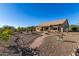 Desert landscape with pathway leading to home's exterior at 10209 W Mustang Dr, Casa Grande, AZ 85194