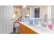 Bathroom with dual vanities, decorative shower curtain, and light wood cabinets at 11432 W Ashland Way, Avondale, AZ 85392