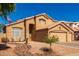 Inviting two-story residence with a three-car garage and desert landscaping at 11432 W Ashland Way, Avondale, AZ 85392