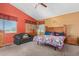 Main bedroom with wooden furniture, ceiling fan, and carpeted floors at 11432 W Ashland Way, Avondale, AZ 85392