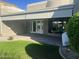 Covered patio with double doors and a grassy yard at 12646 N 17Th Pl, Phoenix, AZ 85022