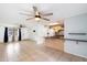 Open living area adjacent to the kitchen, with tiled flooring and ceiling fans at 1344 W Joan De Arc Ave, Phoenix, AZ 85029