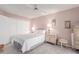 Tranquil bedroom with a ceiling fan, white bedding, and ample closet space at 14015 N 111Th Ave, Sun City, AZ 85351