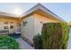 Charming front yard with lush greenery and a cozy porch area at 14015 N 111Th Ave, Sun City, AZ 85351