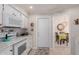 Bright kitchen featuring white appliances, mosaic tile backsplash, and ample counter space at 14015 N 111Th Ave, Sun City, AZ 85351