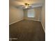 Empty bedroom with a ceiling fan, carpeted flooring, and window with blinds at 1640 E El Parque Dr, Tempe, AZ 85282