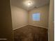 Empty bedroom featuring neutral walls, carpeting, and window with blinds at 1737 W Pollack St, Phoenix, AZ 85041