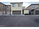 Townhome exterior with attached garage and landscaping at 1737 W Pollack St, Phoenix, AZ 85041