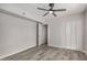 Bedroom featuring wood-look flooring, ceiling fan, and closet at 2021 E Tierra Buena Ln # 11, Phoenix, AZ 85022