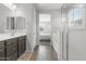 Main bathroom with double sinks, separate shower and tub, and bedroom access at 22459 E Marsh Rd, Queen Creek, AZ 85142