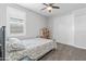 Bedroom with a double bed, window with shutters, and closet at 22459 E Marsh Rd, Queen Creek, AZ 85142