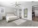 Bright bedroom with a queen-size bed and ceiling fan at 22459 E Marsh Rd, Queen Creek, AZ 85142