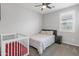 Bedroom with a crib and double bed at 22459 E Marsh Rd, Queen Creek, AZ 85142