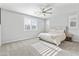 Spacious bedroom with a queen-size bed and large windows at 22459 E Marsh Rd, Queen Creek, AZ 85142