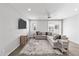 Spacious living room featuring a sectional sofa and ceiling fan at 22459 E Marsh Rd, Queen Creek, AZ 85142