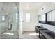 Modern bathroom with double vanity, large shower, and stylish fixtures at 24825 W Western Star Blvd, Buckeye, AZ 85326