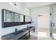 Modern bathroom with double vanity and large mirrors at 24825 W Western Star Blvd, Buckeye, AZ 85326