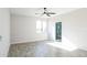 Spacious bedroom with ensuite bathroom and ceiling fan at 24825 W Western Star Blvd, Buckeye, AZ 85326