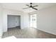 Bedroom with wood-look floors, private door and access to a balcony at 24825 W Western Star Blvd, Buckeye, AZ 85326