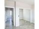 Mirrored closet doors and view of another room at 24825 W Western Star Blvd, Buckeye, AZ 85326