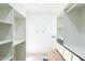 Large walk-in closet with ample shelving and hanging space at 24825 W Western Star Blvd, Buckeye, AZ 85326