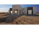 Modern desert home exterior with clean lines and neutral color palette at 24825 W Western Star Blvd, Buckeye, AZ 85326